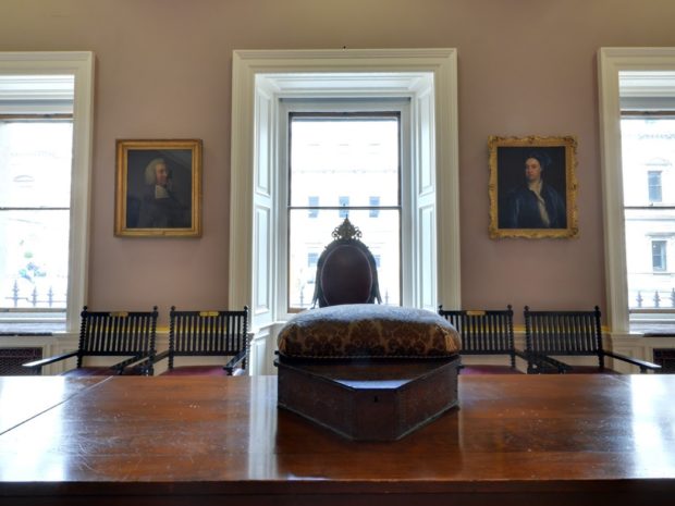 Interior view of large table with windows beyond