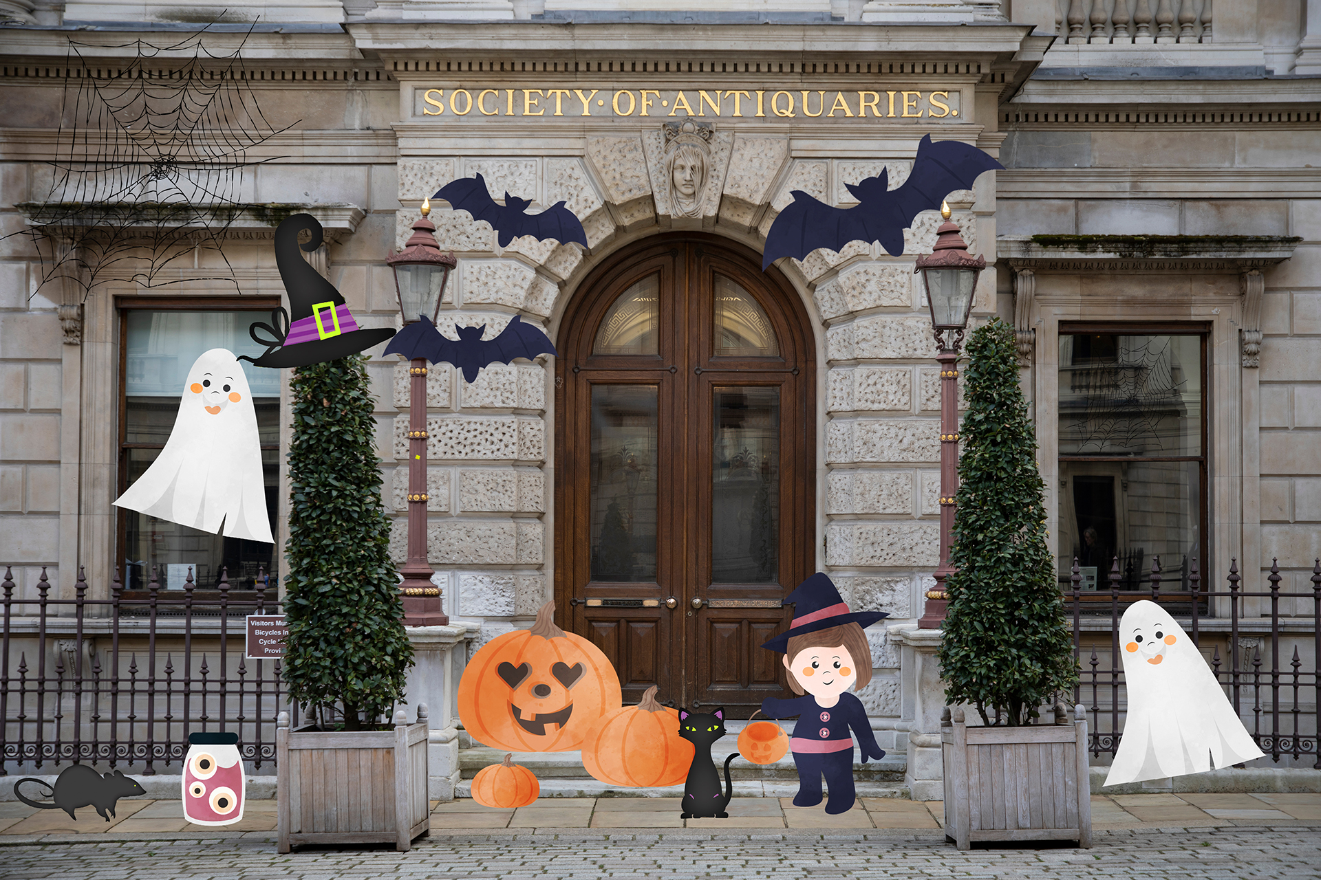 The outside of Burlington House decorated with cartoon Halloween imagery.